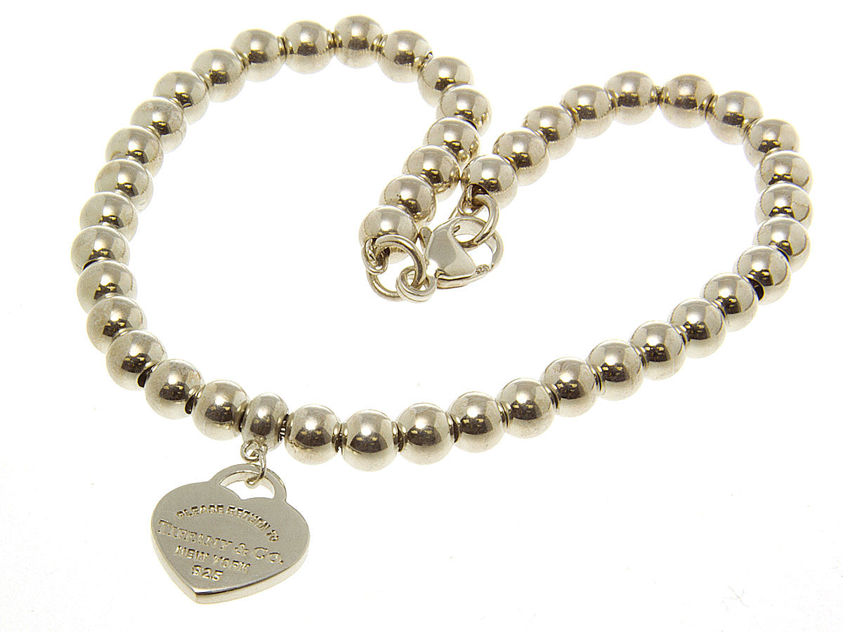 Tiffany & Co. Bead bracelet with Mom heart pendant in sterling silver.